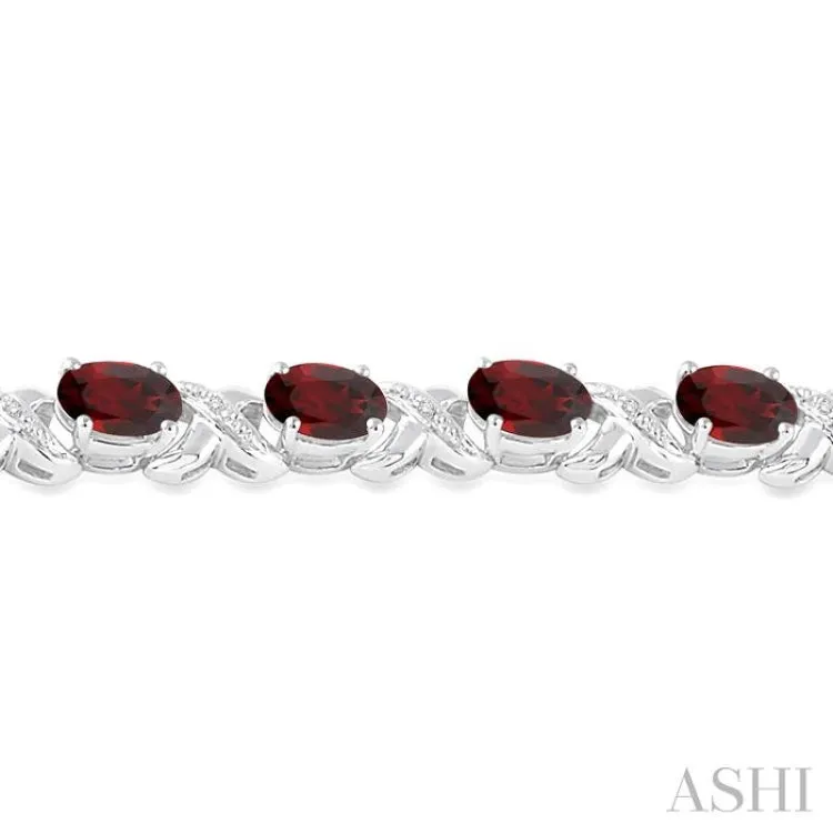 7x5 mm Oval Cut Garnet and 1/20 Ctw Round Cut Diamond Fashion Bracelet in Sterling Silver