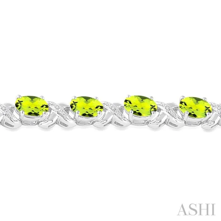 7x5 mm Oval Cut Peridot and 1/20 Ctw Round Cut Diamond Fashion Bracelet in Sterling Silver