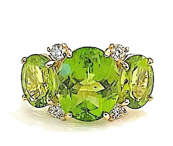 Elegant Three-Stone Ring with Gold Rope Twist Border with Blue Topaz and Peridot